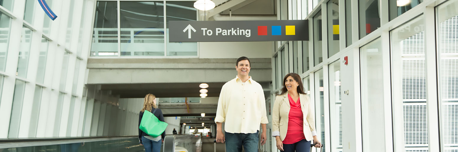 Man and Woman Walking through airport