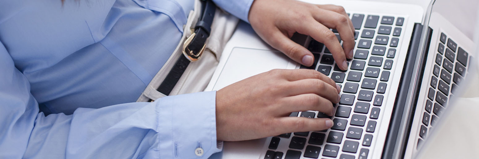 Man typing on laptop computer